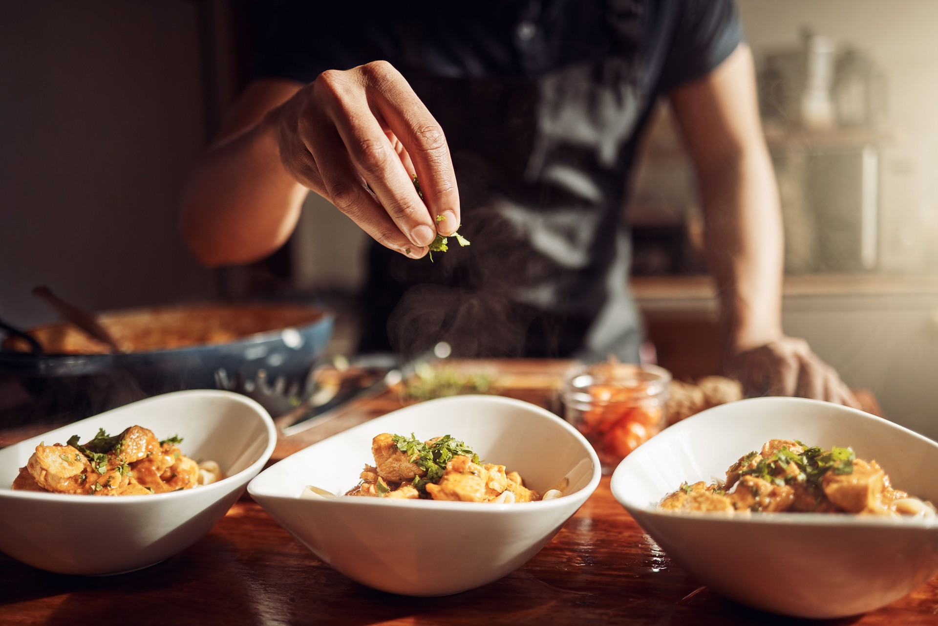 Shot of an unrecognisable man preparing a delicious meal at home